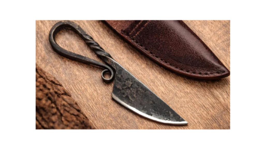 Knife with leather sheath on a wooden surface
